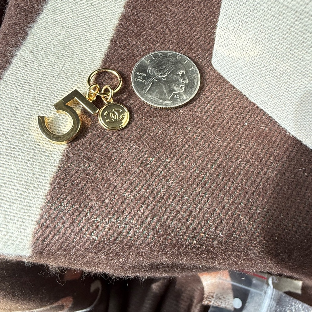 Gold Chanel Number 5 Charm with Emblem from Holiday 2024